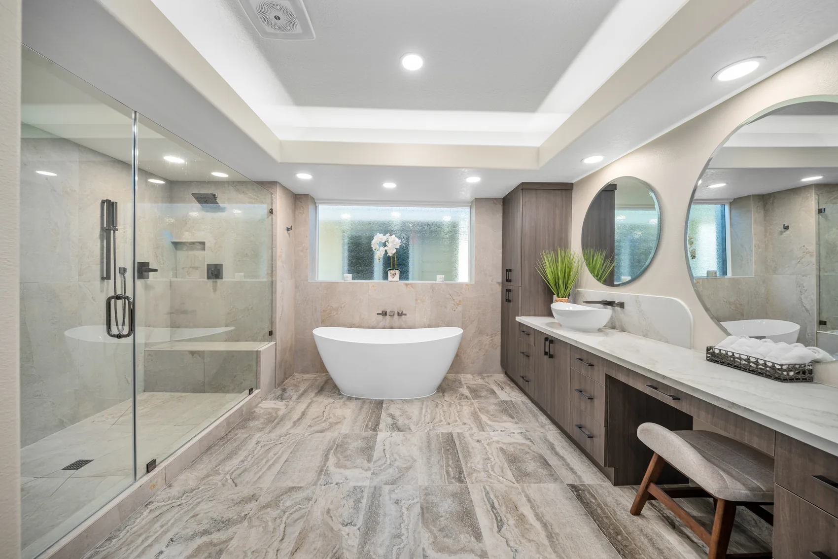 Bathroom remodel with glass shower, freestanding tub, and double vanity